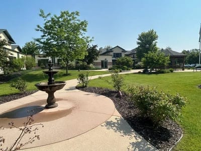 A beautiful garden area with fountain and walkways