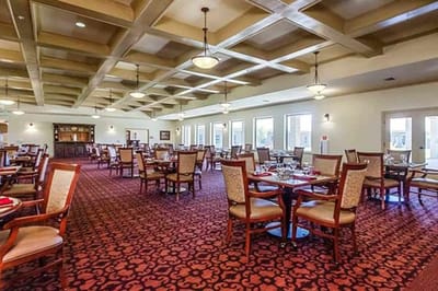 Dining room setup with tables and chairs