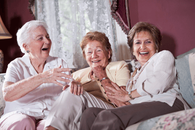 Three senior women enjoying a moment together