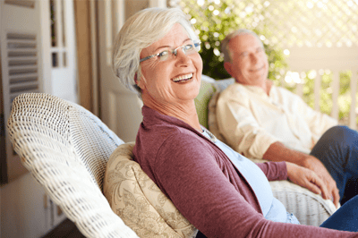 Two seniors enjoying time together outdoors.