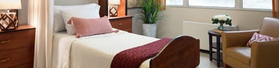 Cozy private resident room with furnishings.