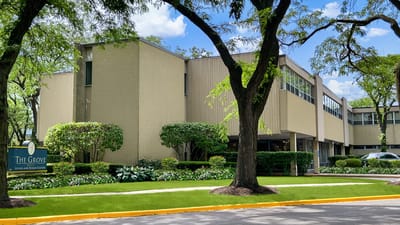 Exterior view of The Grove building and landscaping.