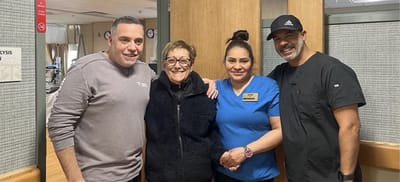 Staff member with resident and two visitors