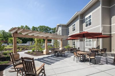 Outdoor patio area with seating and shade structures.