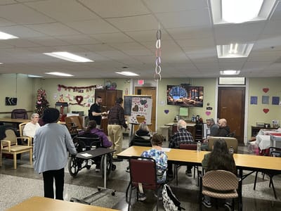 Residents and staff participating in an activity in a common area