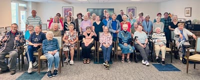 Residents and staff gathering in a common area