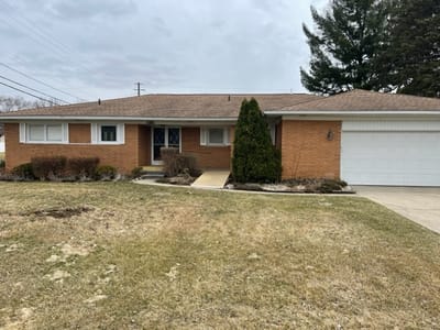 Exterior view of a brick building with yard
