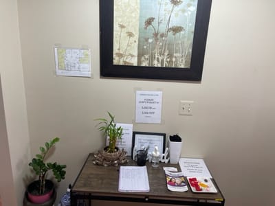 Reception area with signage and plants