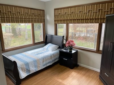 Cozy bedroom with natural light and floral decor