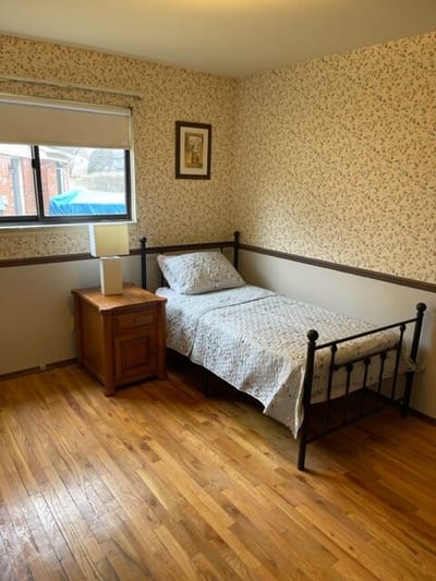 Cozy bedroom with a bed and lamp