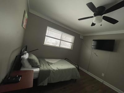 Cozy bedroom with bed and TV