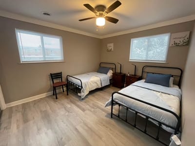Bright and simple shared bedroom with two beds