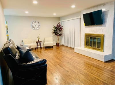 Comfortable common area with seating and a fireplace.
