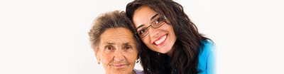 Smiling elderly woman with caregiver