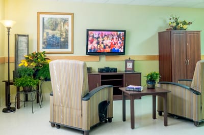Common area with seating and television.