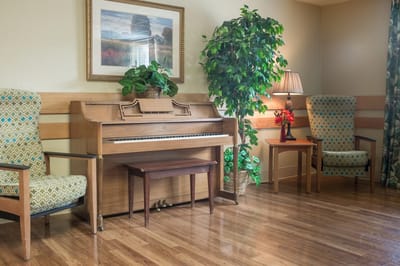 Interior common area with a piano and seating