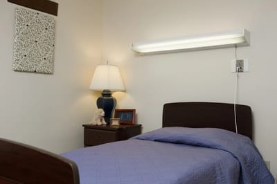 Cozy resident bedroom with personal items.