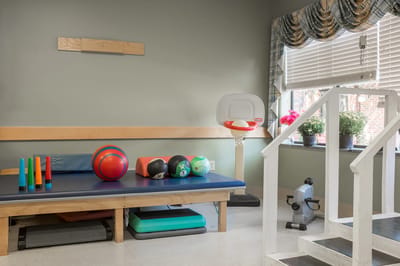 Activity space with exercise equipment and balls