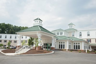 Exterior view of Country Meadows facility with entrance.