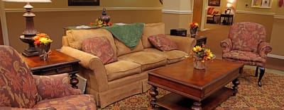 Cozy common area with floral decorations and furniture