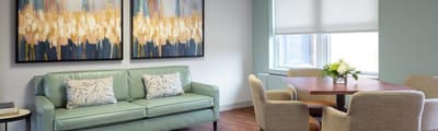 Bright interior common area with seating and artwork