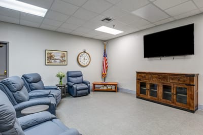 Common area with seating and decor in a senior living facility