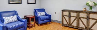 Bright and inviting lounge area with blue chairs
