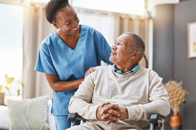 A caregiver smiling at a senior resident