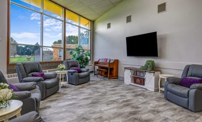 Common area with comfortable seating and large windows
