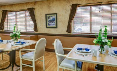 Interior view of dining room with set tables