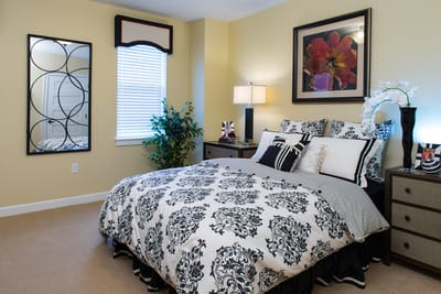 Cozy resident room with decorative bedding and furnishings