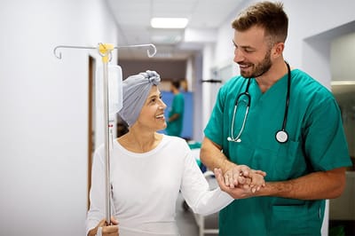 Healthcare professional assisting a patient in a hallway
