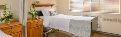 Bright private resident room with flowers and personal touches