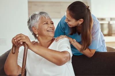 Avantara Mountain View, Nursing Home in Rapid City, SD — Senior caregiver interacting happily with an elderly resident