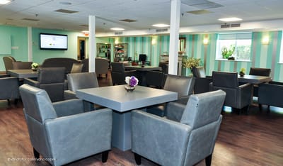 Bright common area with modern seating and decor