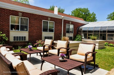 Patio area with comfortable seating and greenery