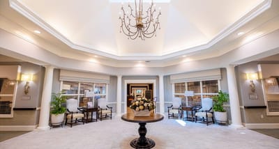 Bright interior lobby with chandelier and seating
