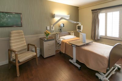 Private room with a bed and seating area