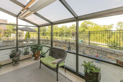 Sunroom area with plants and seating