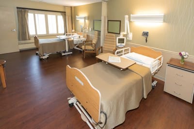 Private resident room with medical bed and furniture