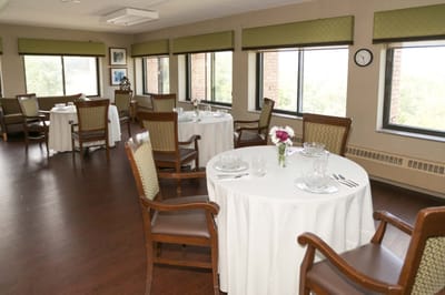 Dining room with tables set for meals