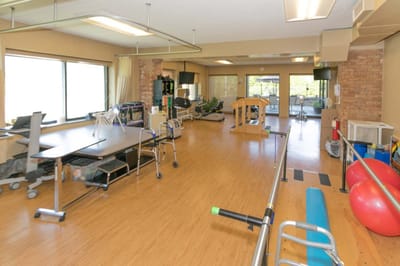 Rehabilitation therapy room with equipment and exercise space