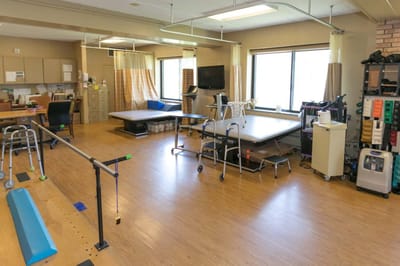 Interior rehabilitation therapy space with equipment.