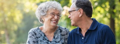 A joyful senior couple enjoying time outdoors.