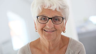 Smiling senior woman wearing glasses