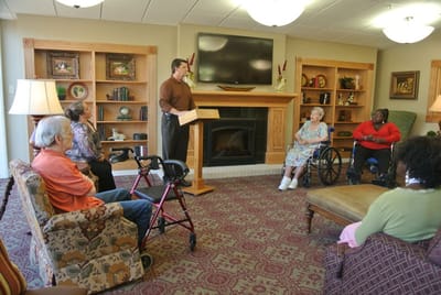 Residents engaged in a group activity in the common area.