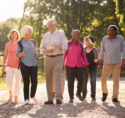Group of seniors walking together outdoors