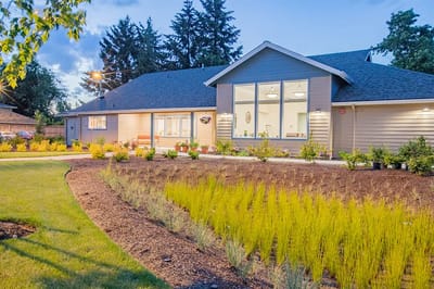Exterior view of McKenzie Living with landscaping.