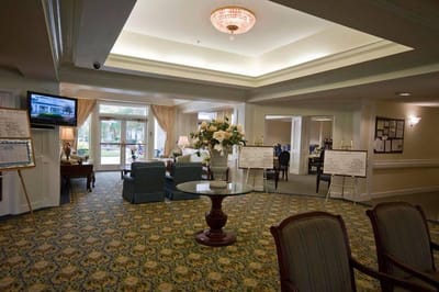 Bright common area with seating and flower arrangements