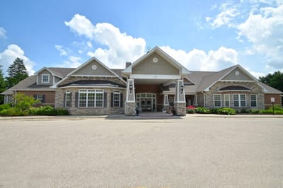 Exterior view of a senior care facility on a sunny day